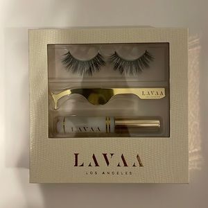 Brand new fake eyelashes, with glue and tweezers